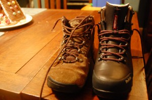 hiking boots on a wood table