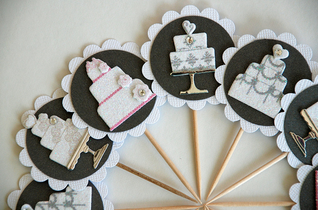 Bridal shower cupcake toppers arranged in a semi-circle.