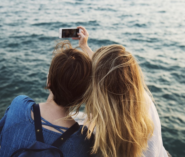 Two people taking selfie - Tips on Targeting Millennial Shoppers