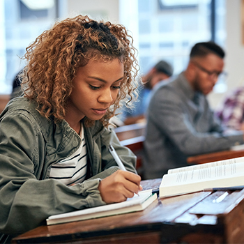 A university student studying. Gated offers are emerging as a powerful way to reach college students and other target segments.