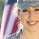 A smiling military woman appreciates how hospitality companies are marketing to the military.