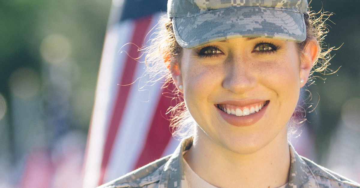 A smiling military woman appreciates how hospitality companies are marketing to the military.