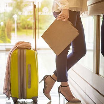 A woman checking into a hotel used digital verification to confirm her room upgrade and improve her customer experience.