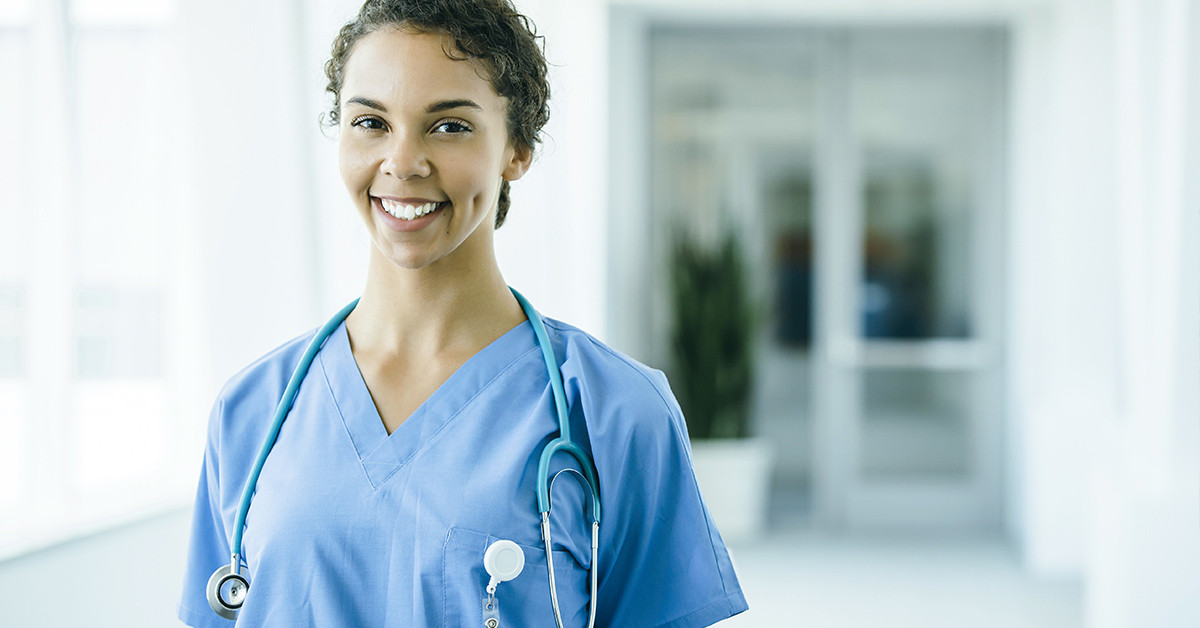 A photo of a smiling nurse. Marketing to nurses with exclusive offers is a great way to boost customer acquisition and loyalty.