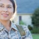 A military woman smiling because she feels honored by Levi's new customer acquisition program providing the military community with exclusive discounts.