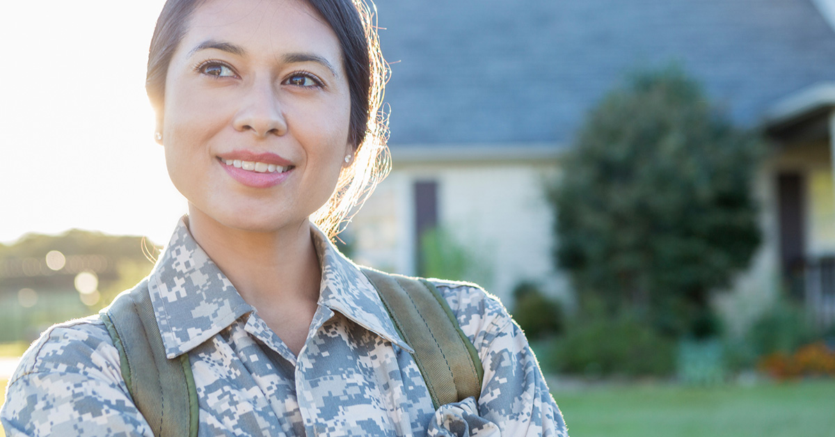 A military woman smiling because she feels honored by Levi's new customer acquisition program providing the military community with exclusive discounts.