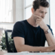 A male marketer in front of his laptop, worried about his unprotected personalized offer.