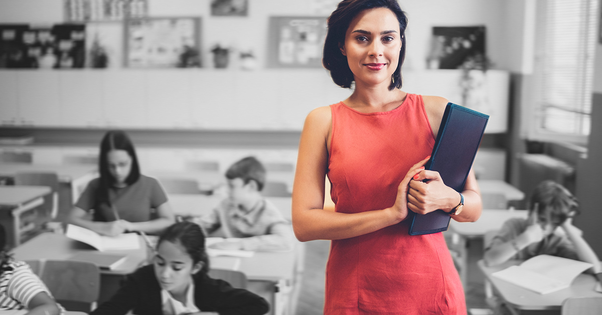 A female teacher in a classroom.