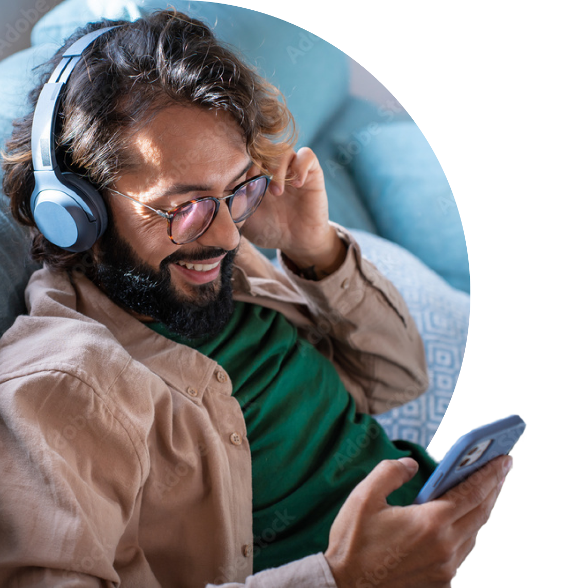 Young man listening to music on phone.
