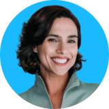 Circle headshot of a woman with blue background.