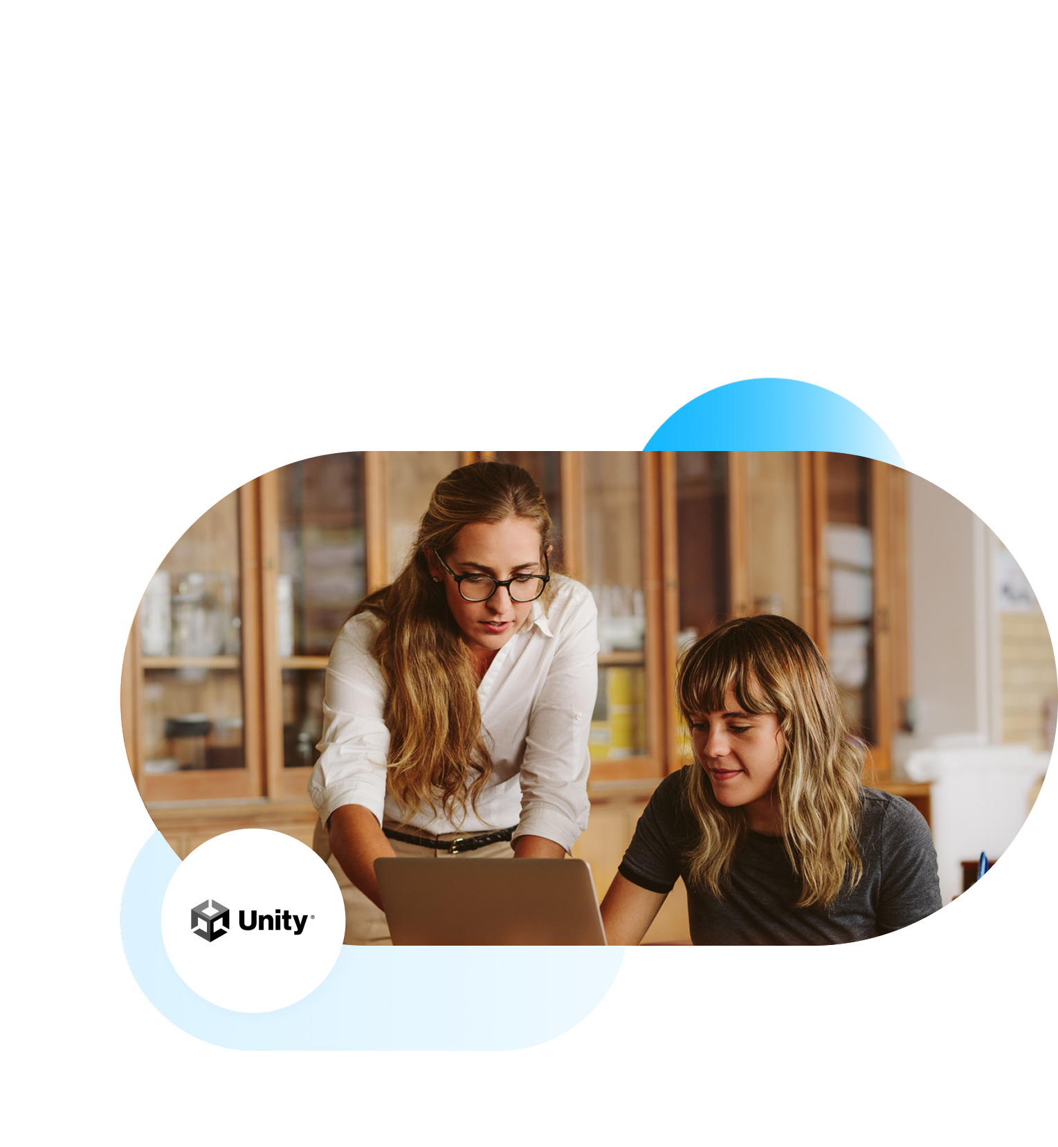 Unity branded image of teacher assisting student on laptop.