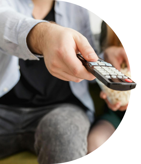 Stylized image of hand holding remote.