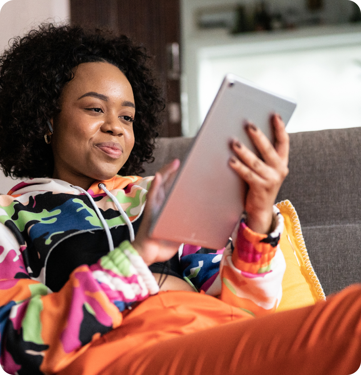 Woman relaxing using tablet.