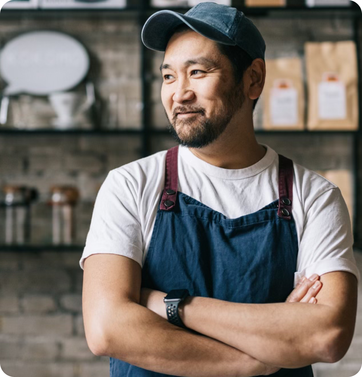 Retail shop owner standing.