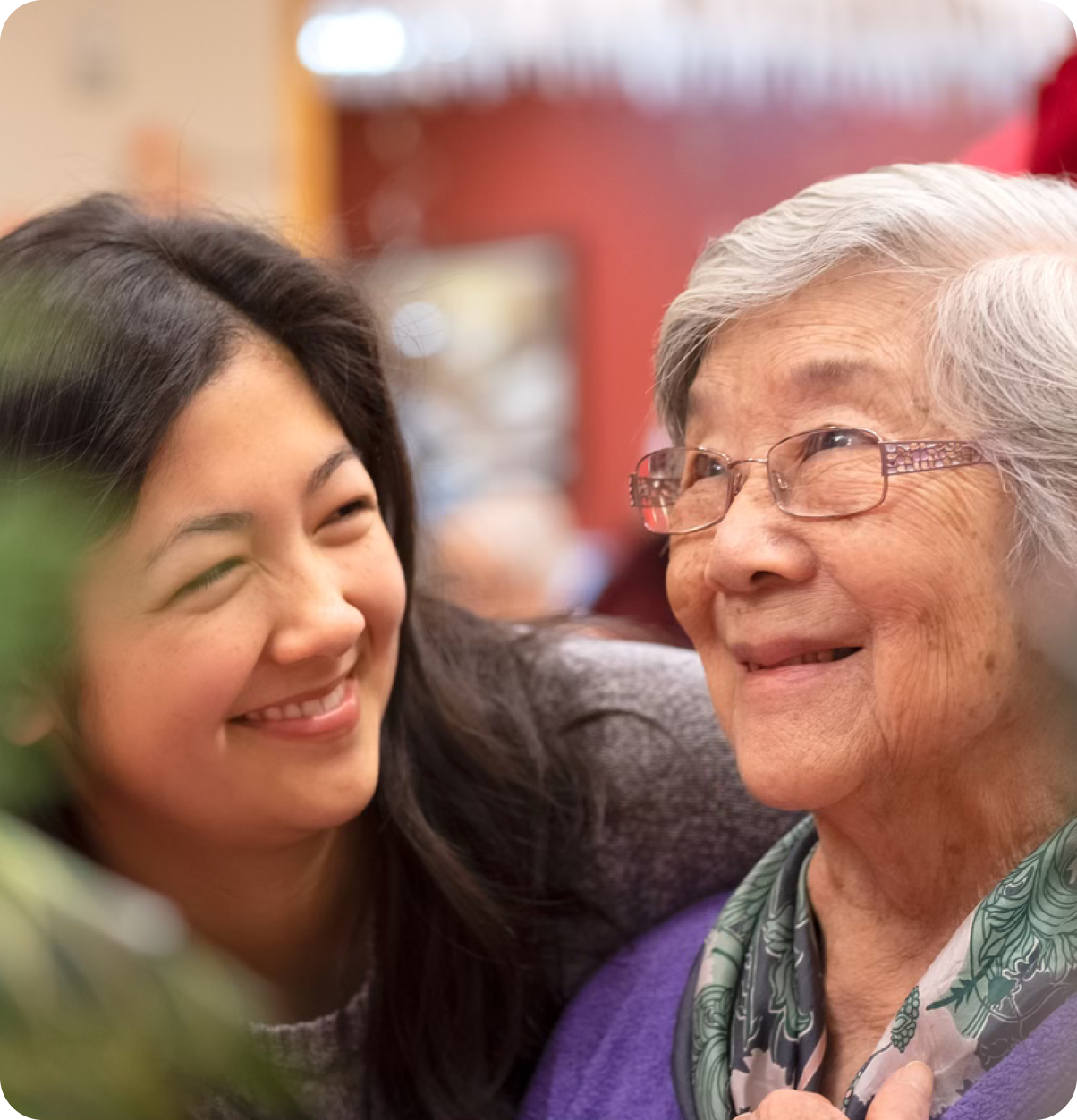 Two older adults smiling.