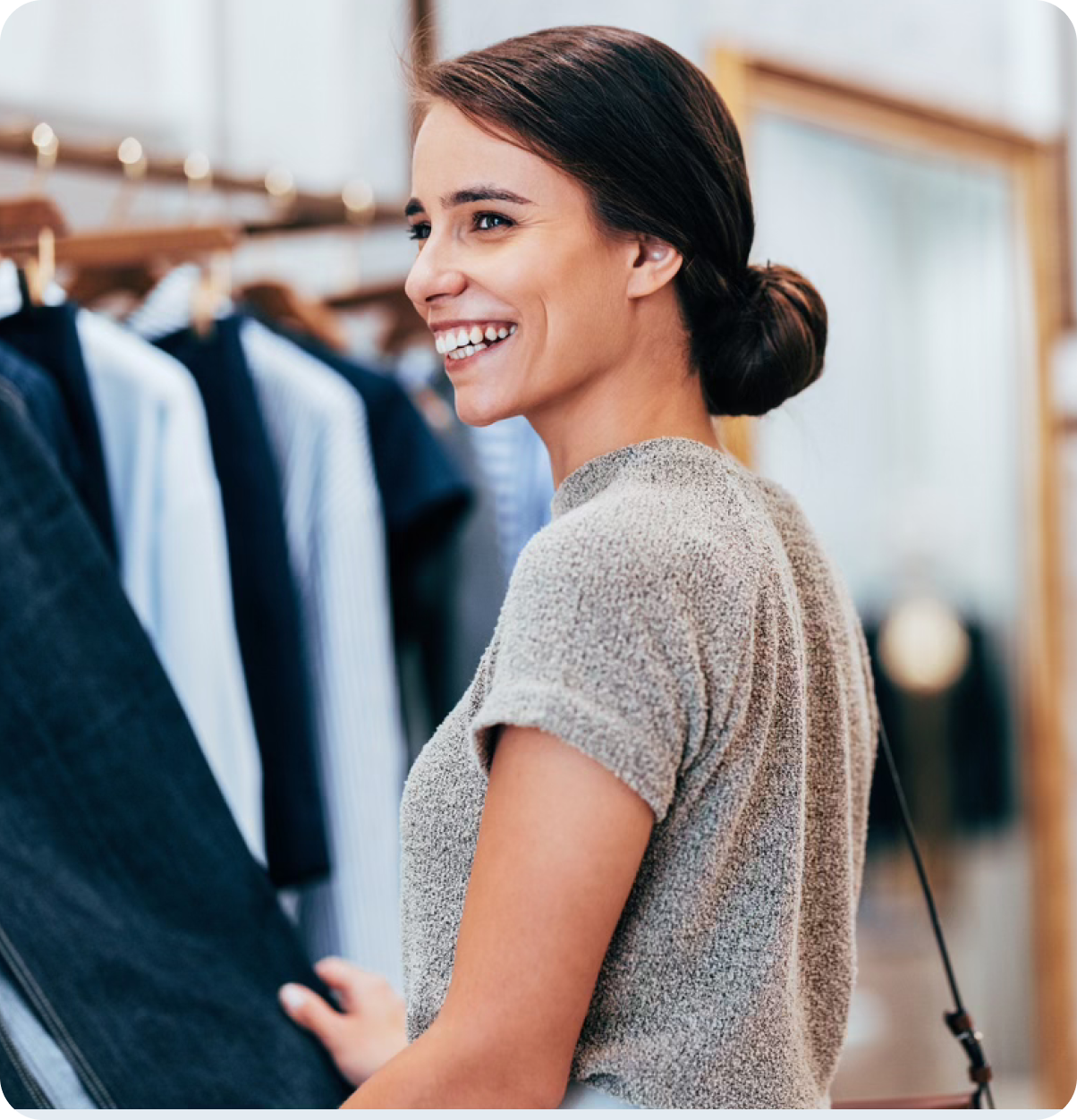 Smiling woman in clothing store.