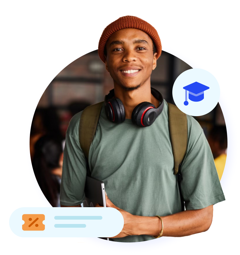 Smiling student headshot with laptop, beanie, and headphones.