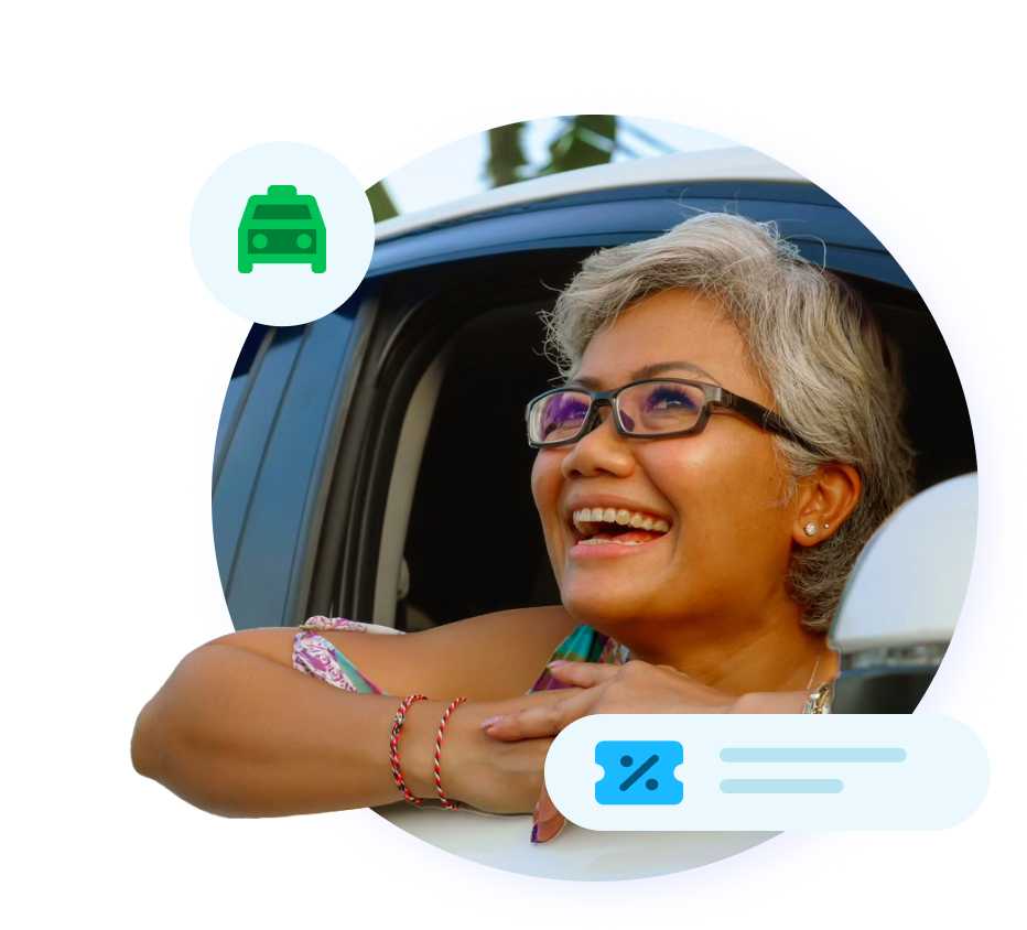 Woman smiling outside of car window.