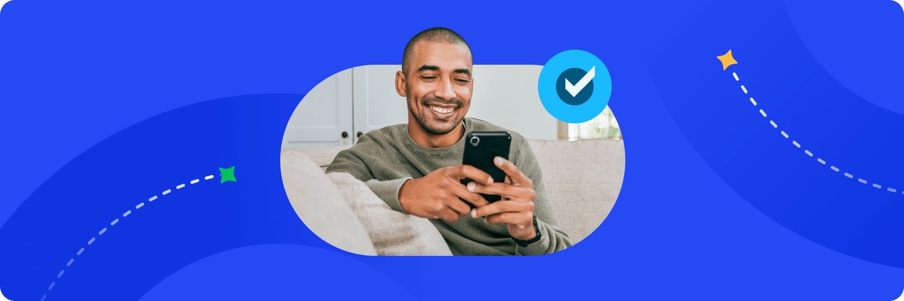A man smiling while holding a phone, accented by a blue checkmark icon signifying successful verification.