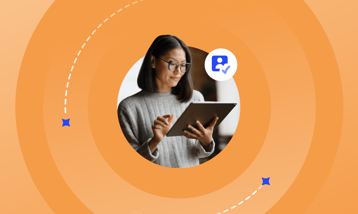 Woman using a tablet with a verified user icon, representing audience verification software in action.
